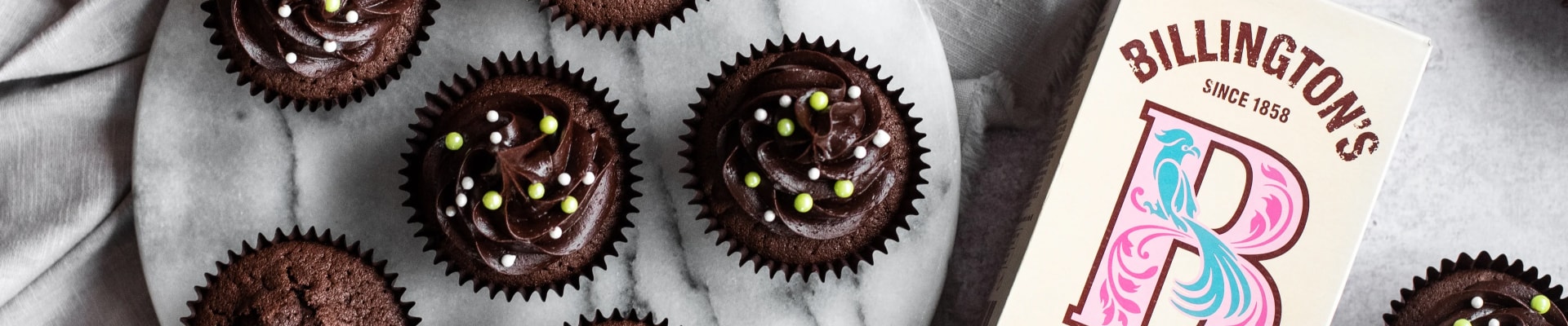 Chocolate cupcakes iced using the Billington's Golden Icing natural unrefined cane sugar