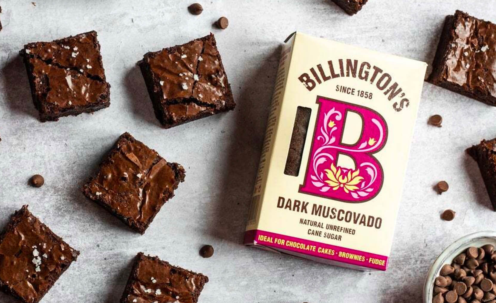 Chocolate brownies arranged around a packet of Billington's Dark Muscovado Sugar.