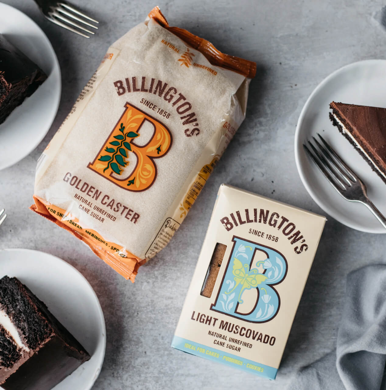 Billington's sugars alongside slices of rich chocolate cake.